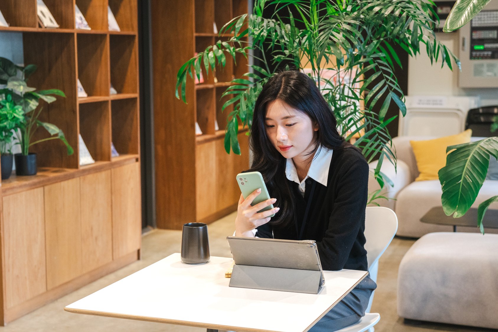 Female Office Worker Using Her Phone